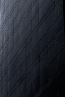 Dark modern building facade with geometric pattern
