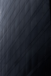 Dark modern building facade with geometric pattern