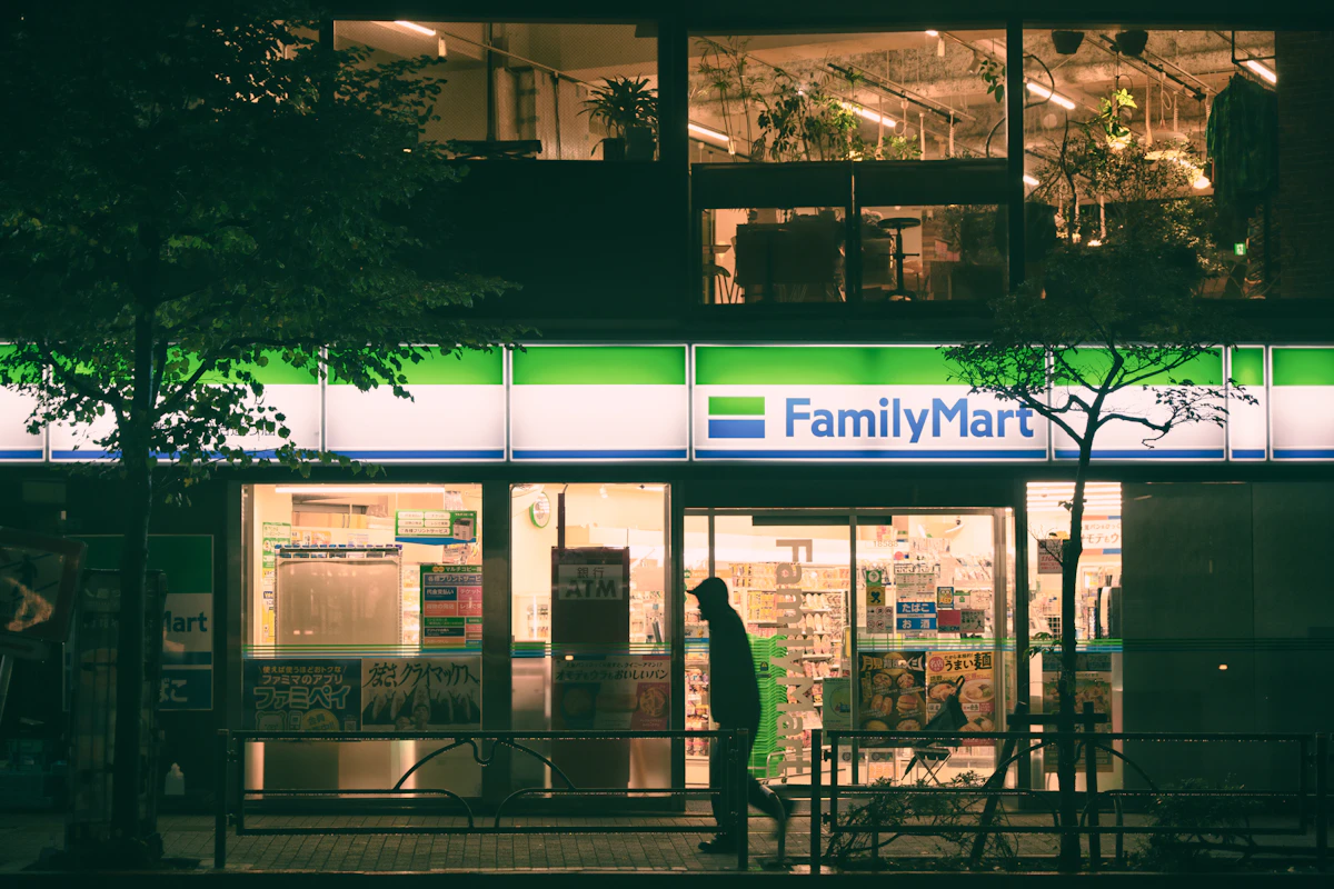 FamilyMart convenience store at night in Japan with glowing neon sign