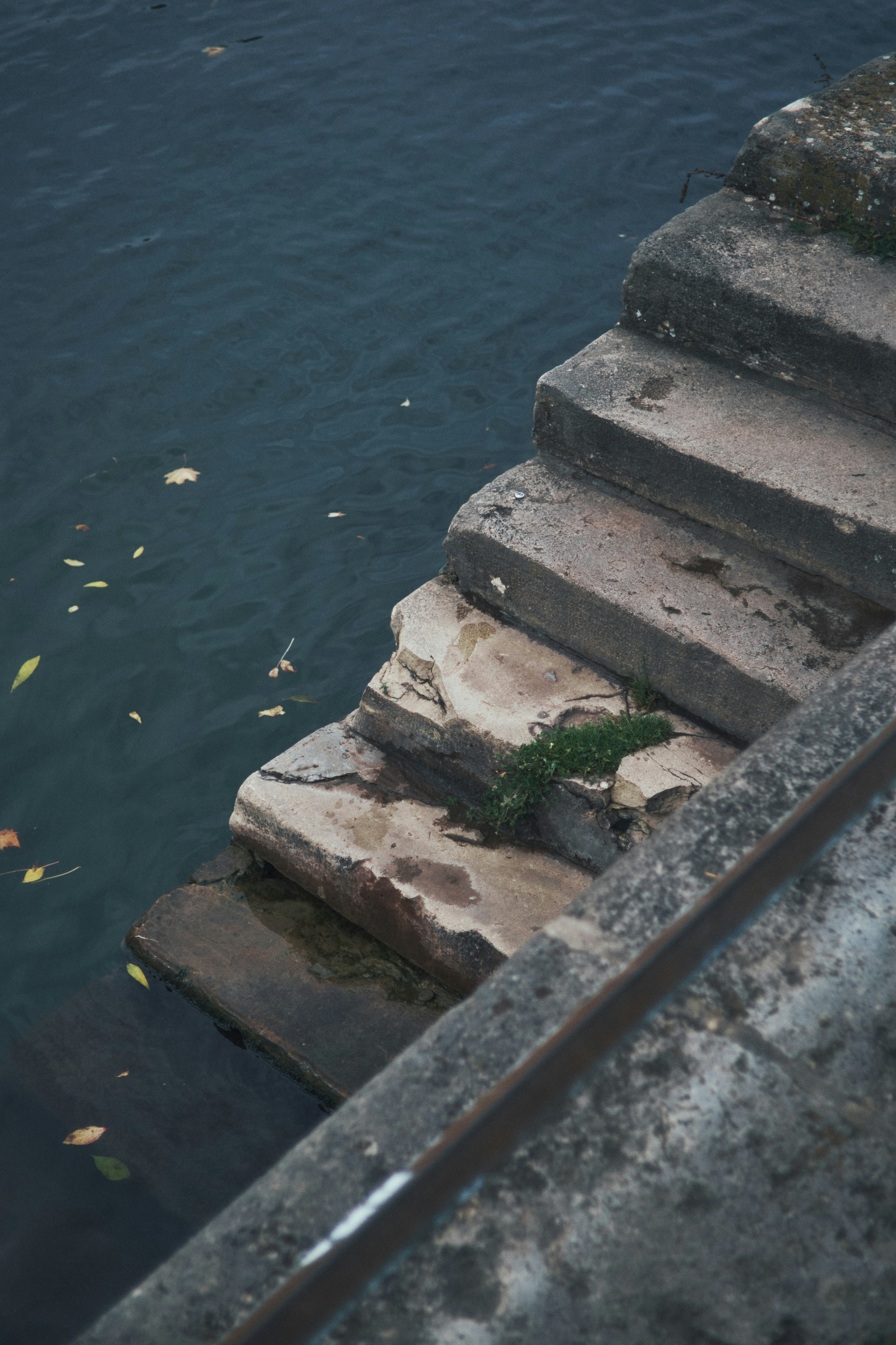Stone steps descend into dark water