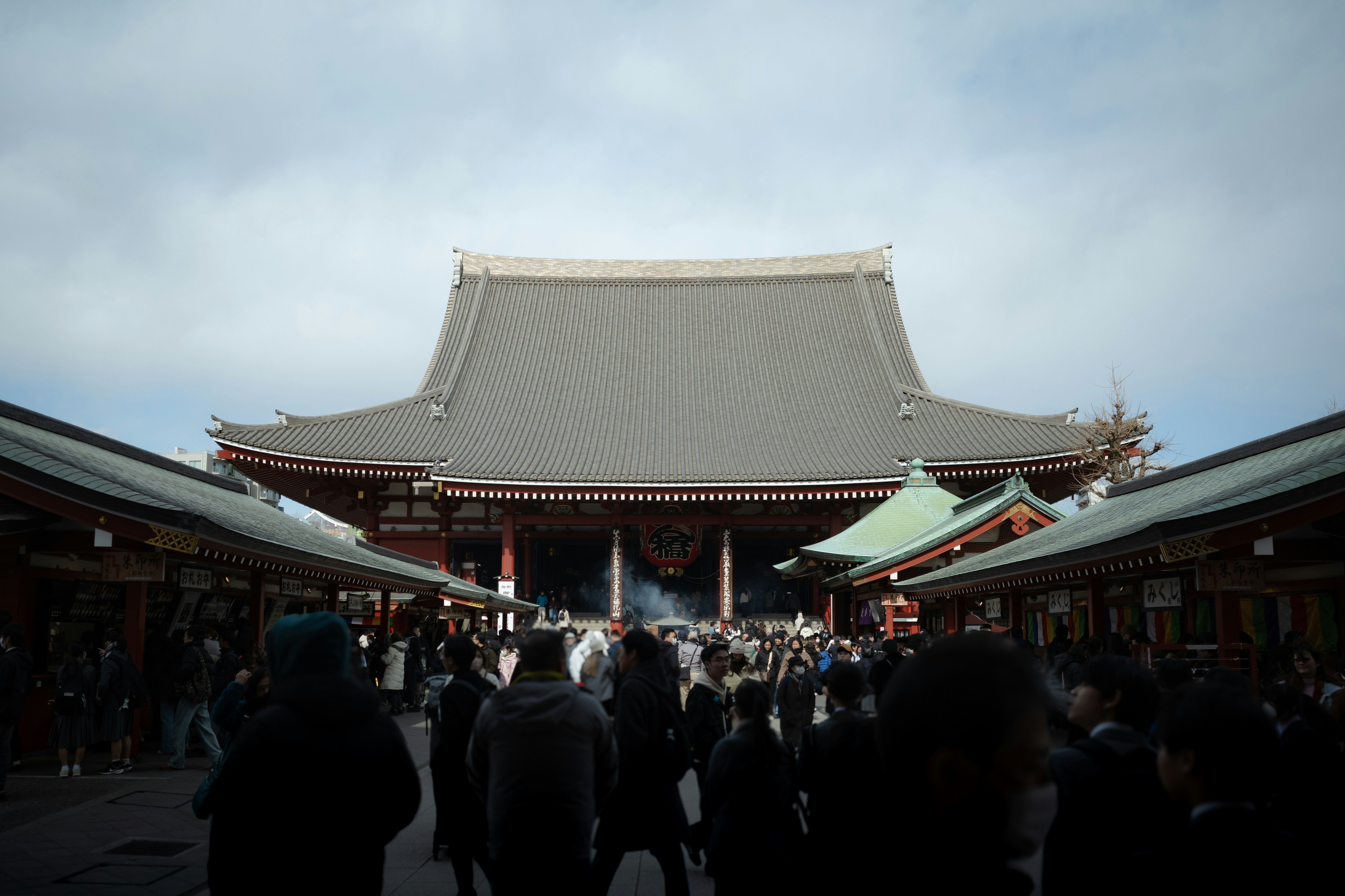 crowded temple grounds with traditional architecture