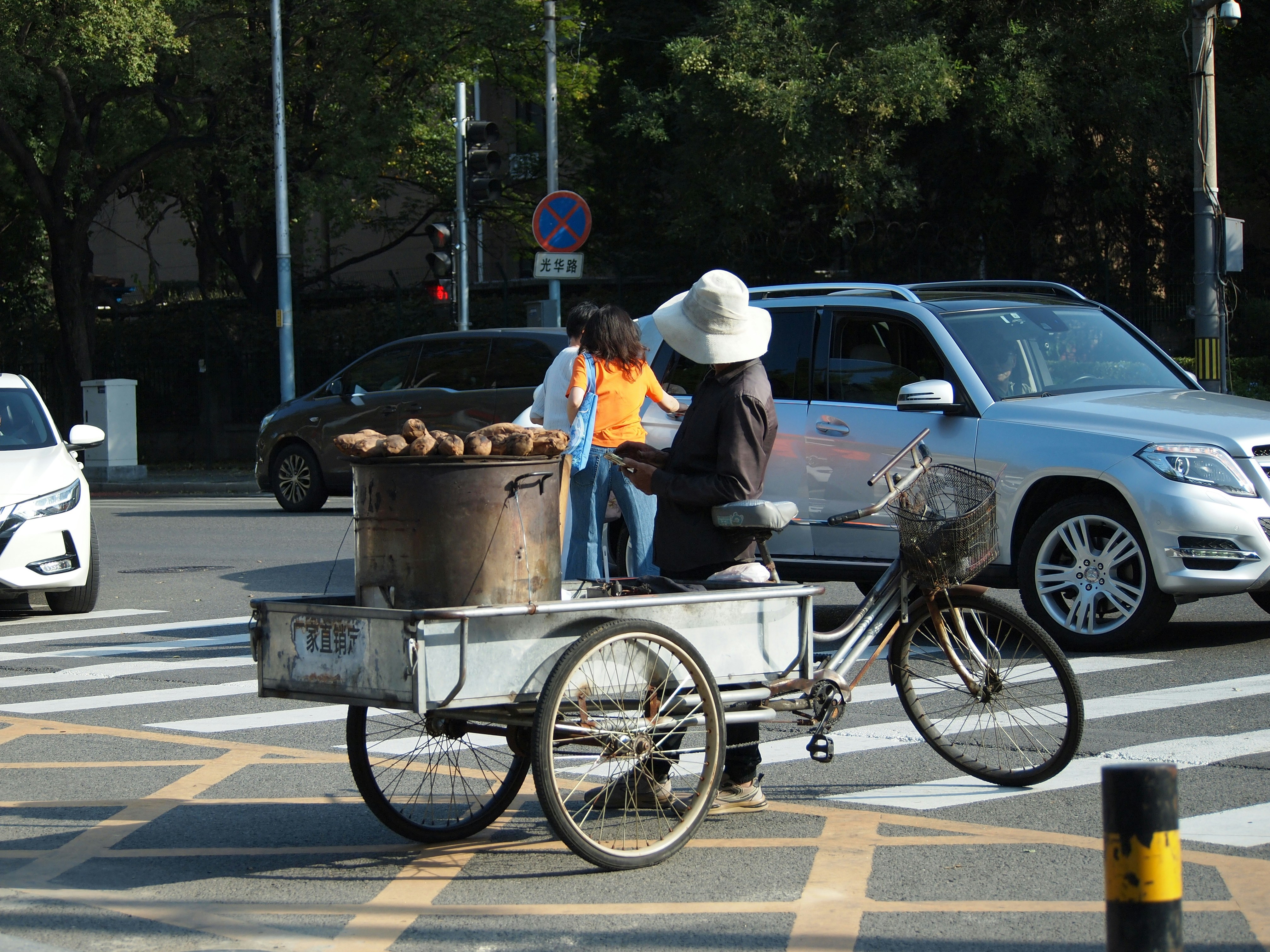 Street vendor with cart selling roasted chestnuts.