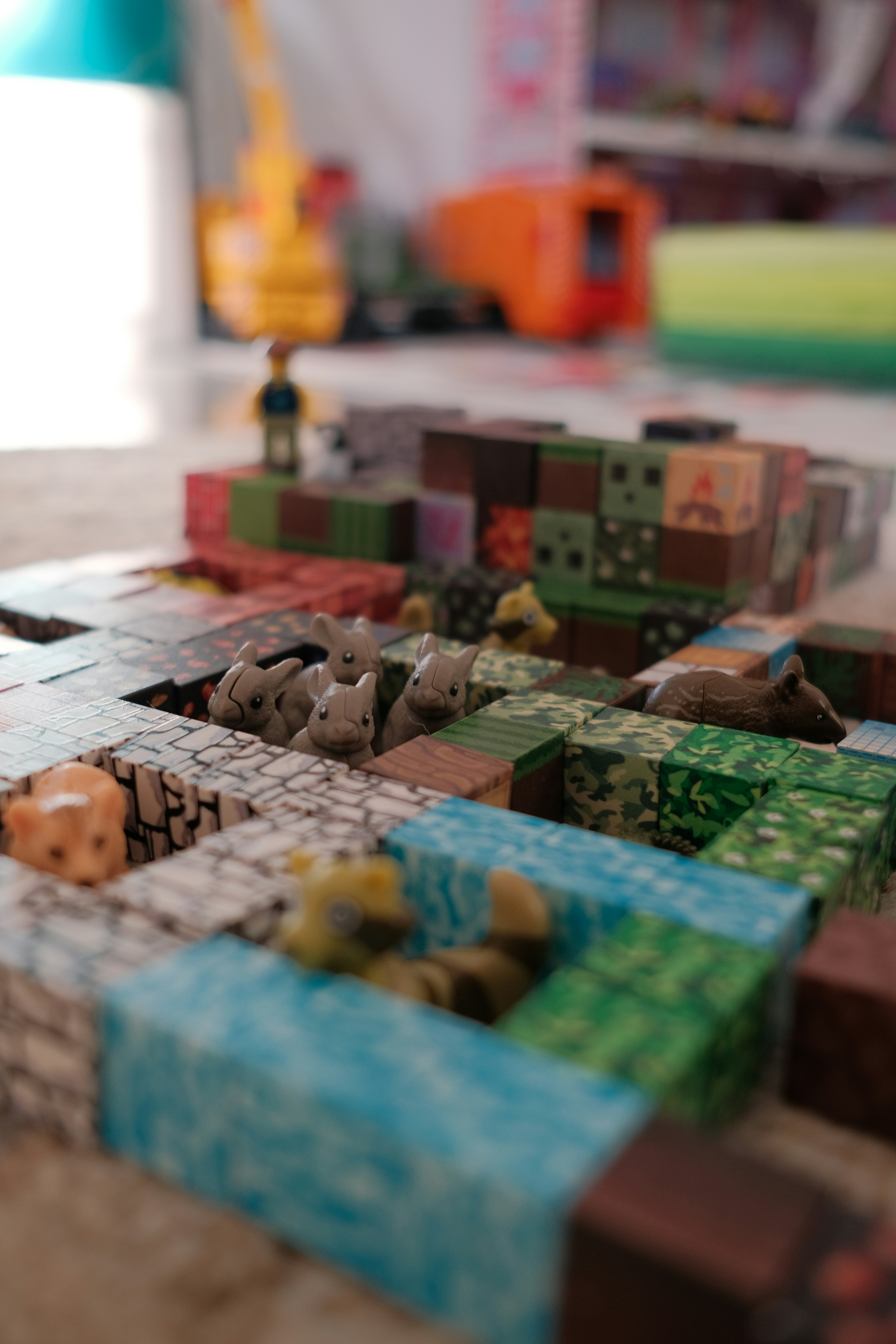 Small toy animals in a block city
