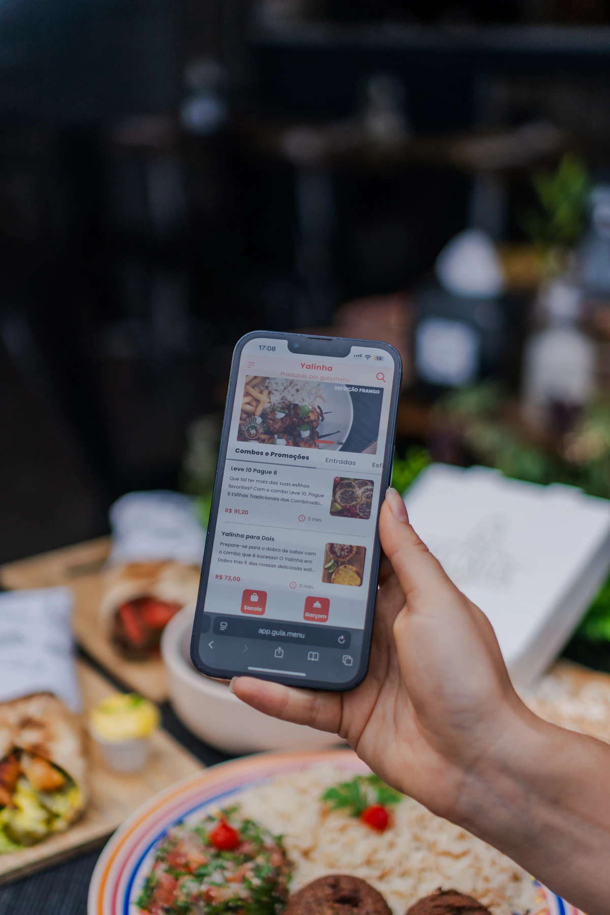 A guest using a mobile food-ordering interface at a restaurant table