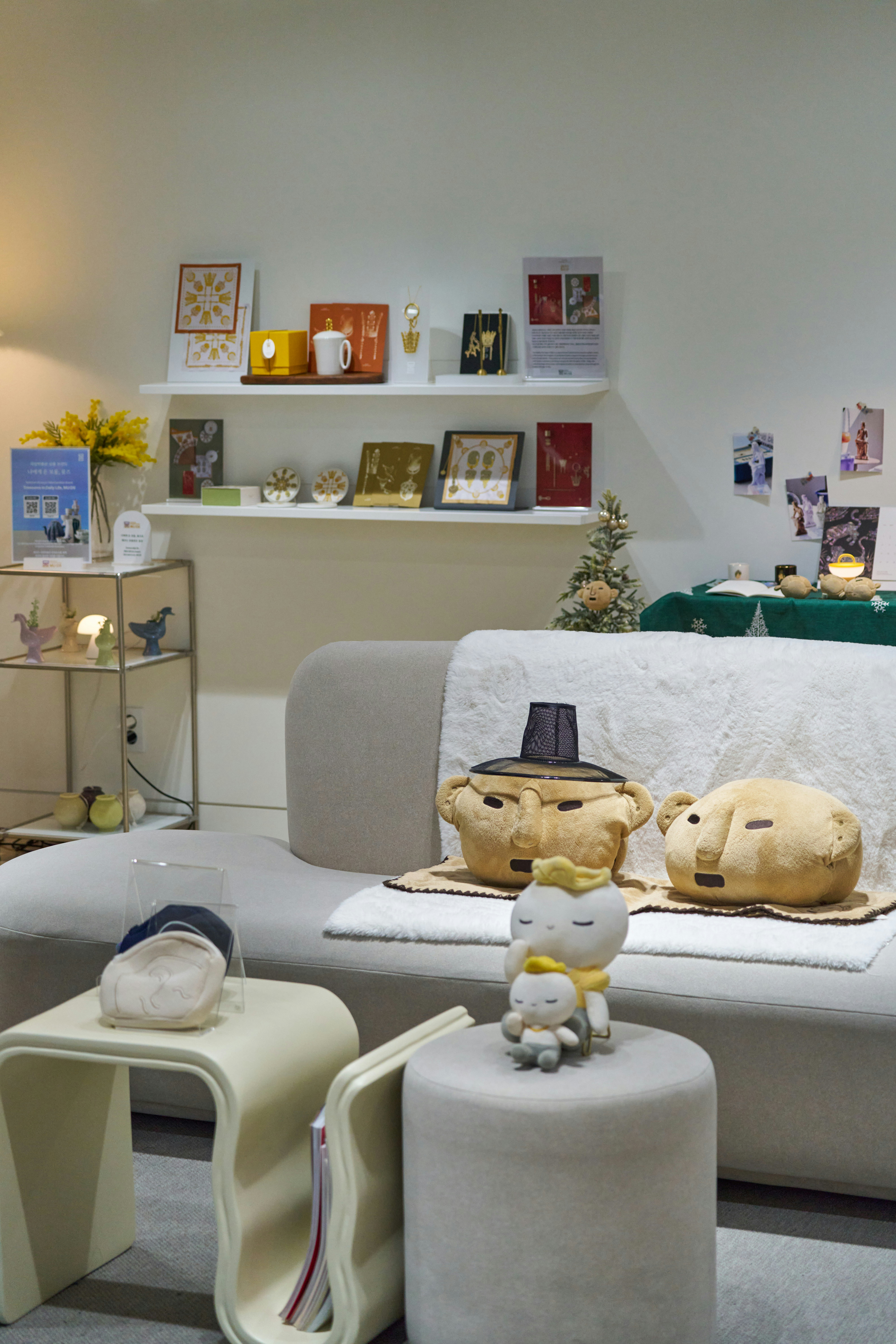 Cozy living room display with plush toys and decor.