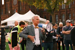 Man with megaphone speaking to a crowd