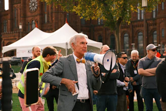 Man with megaphone speaking to a crowd