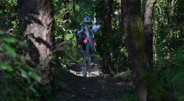 Mountain biker descending rocky singletrack on Drop Shaft trail at Virginia Canyon Mountain Park