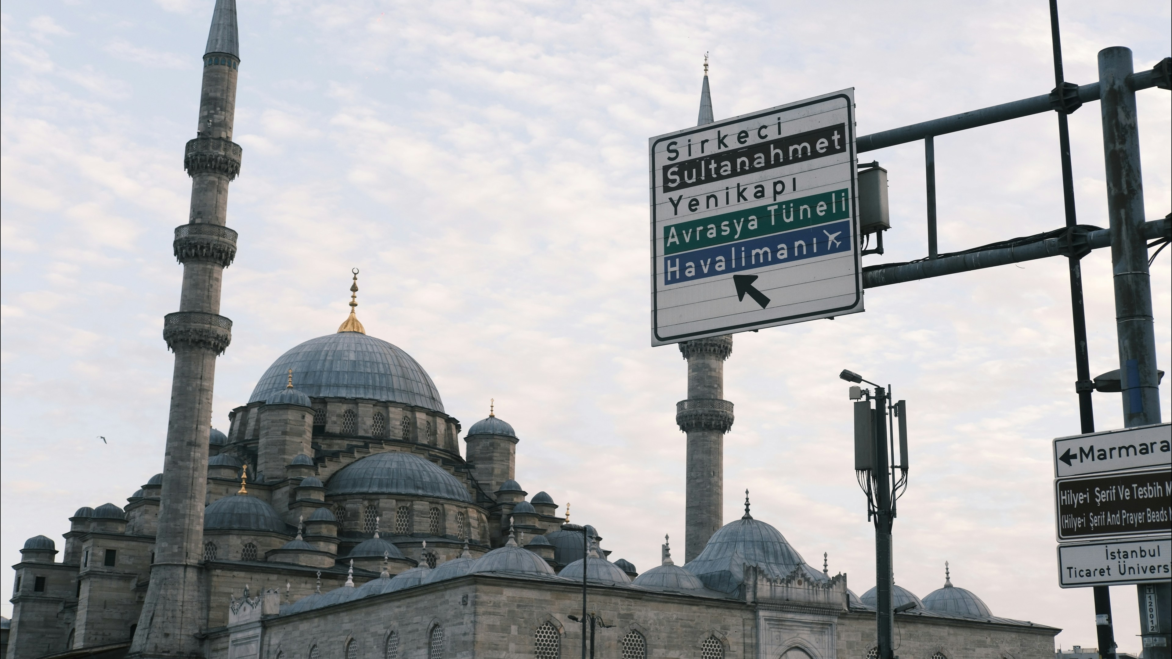 Mosque with a street sign and minarets