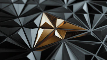 Geometric gold starburst on dark background