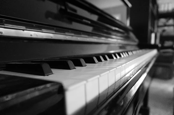 Close-up of a piano keyboard in black and white