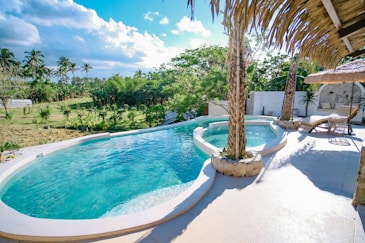 Tropical resort with infinity pool and palm trees