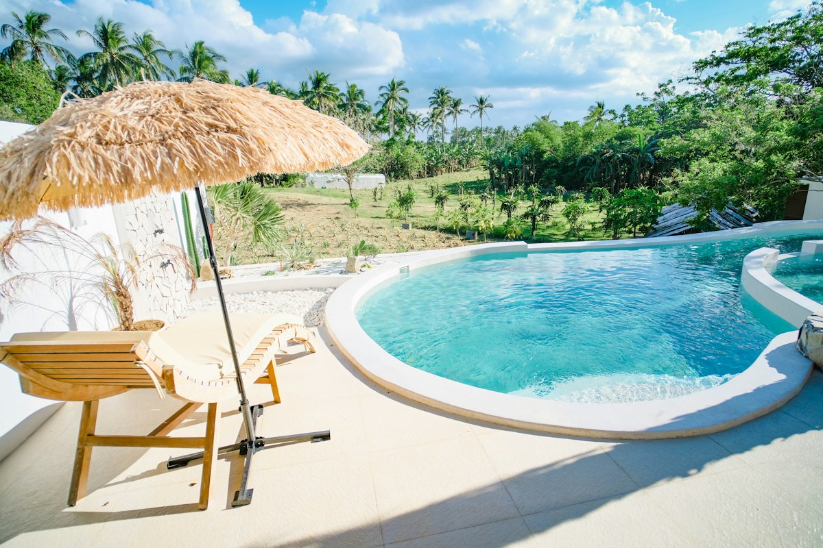 Inspiration photograph of a pool setting; not a photograph of Iberostar Waves Bouganville Playa