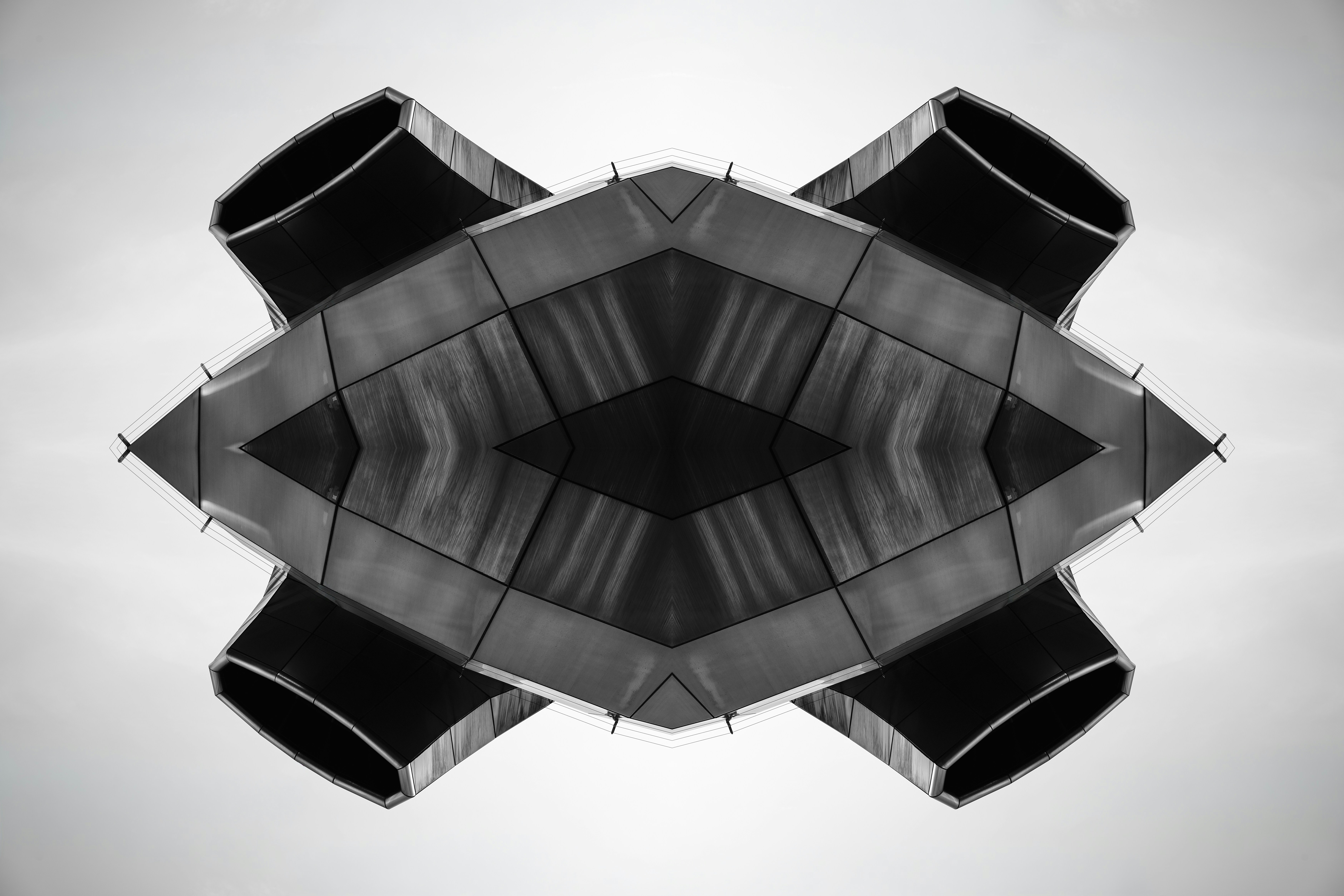 Symmetrical industrial structure with four exhaust pipes.