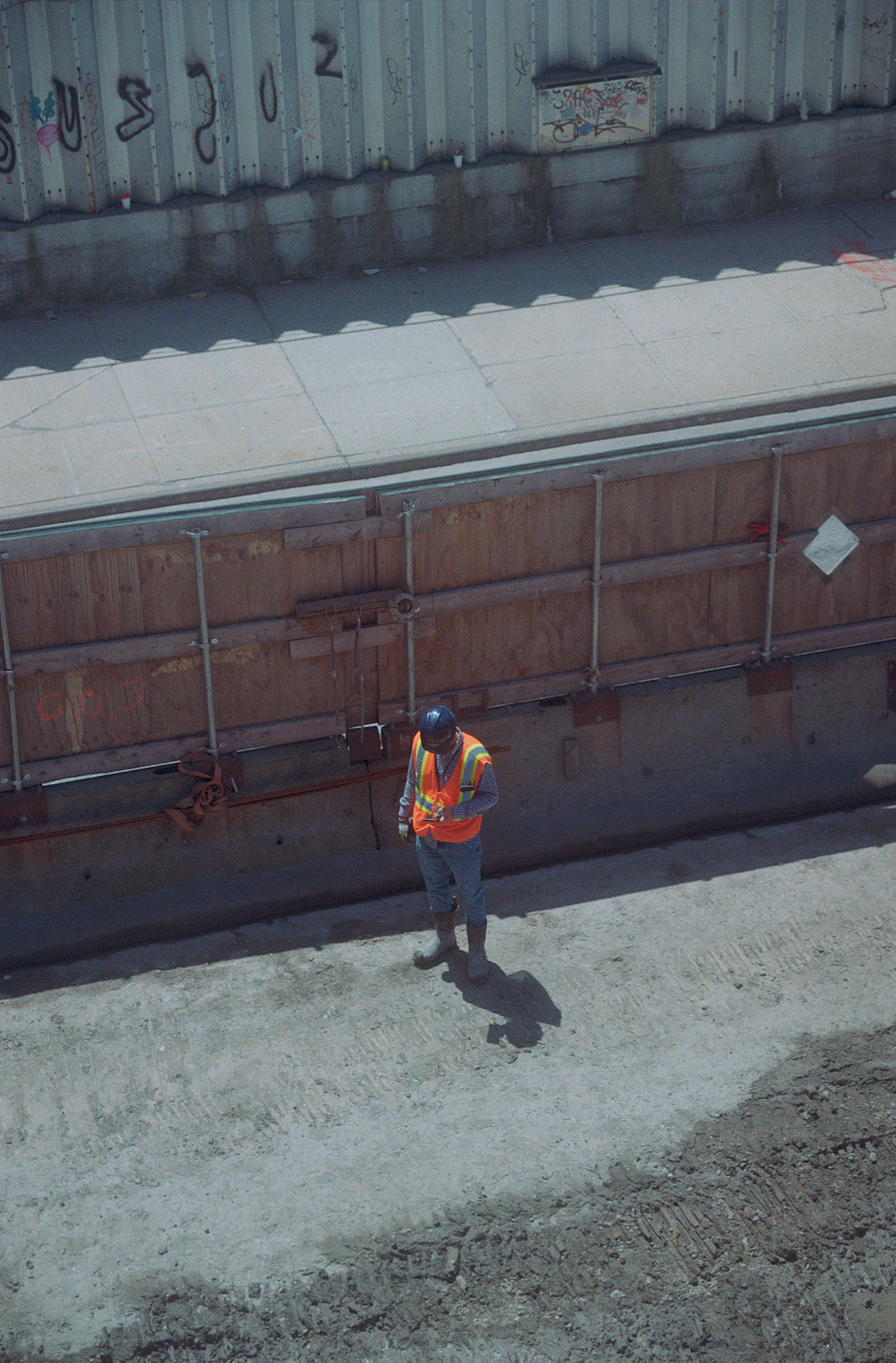 Construction worker in hi-vis safety vest on site
