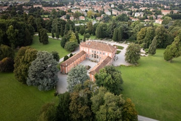 Historic villa surrounded by lush green parkland
