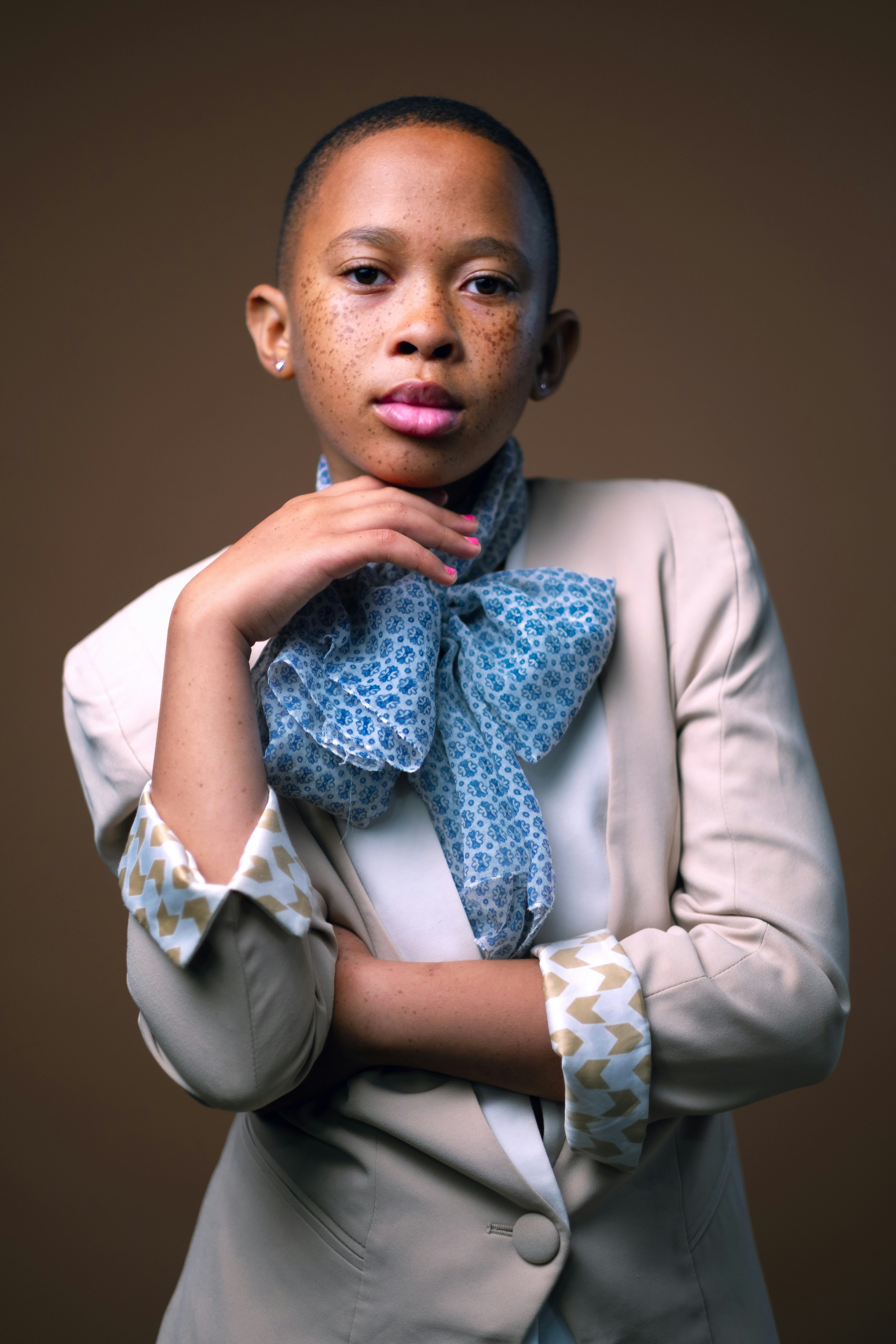 Young woman with short hair wearing a scarf and scarf