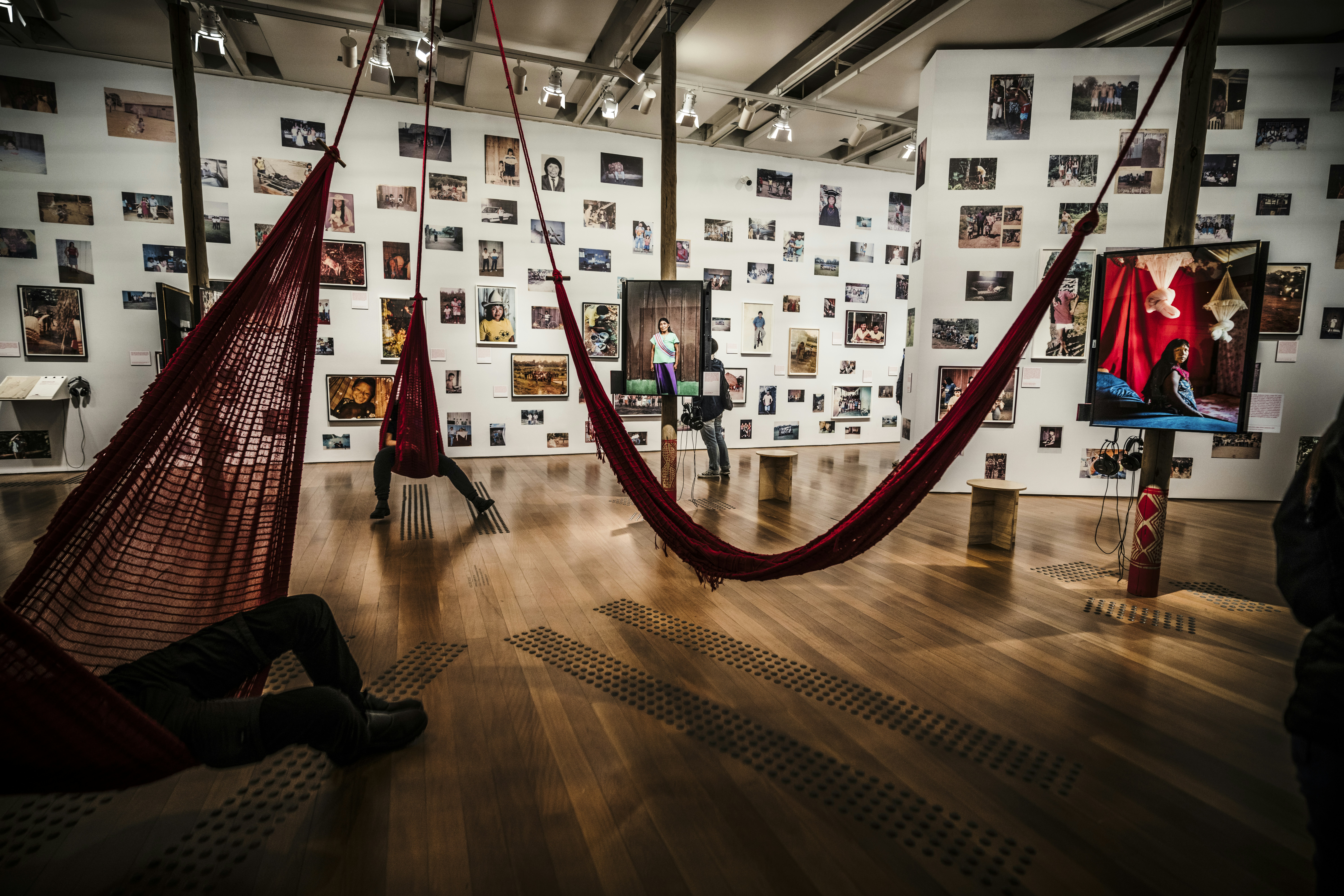 Art gallery with hammocks and displayed artwork