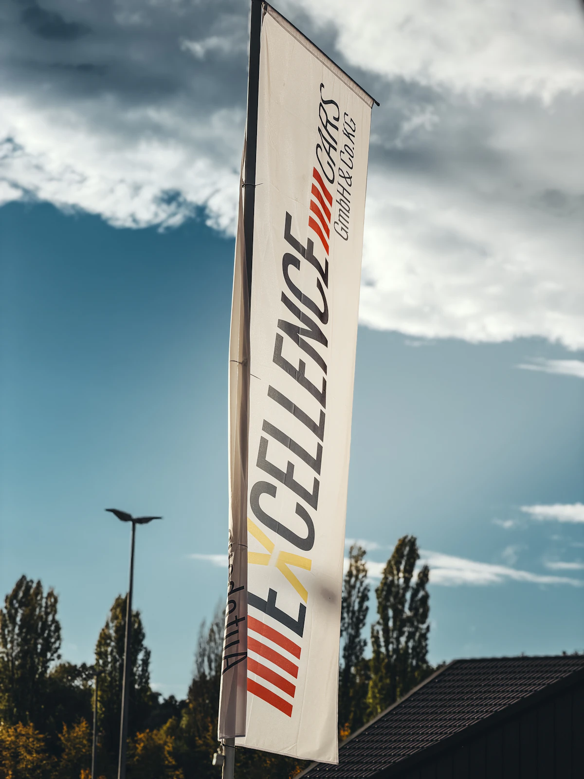 Printed white promotional flag outdoors