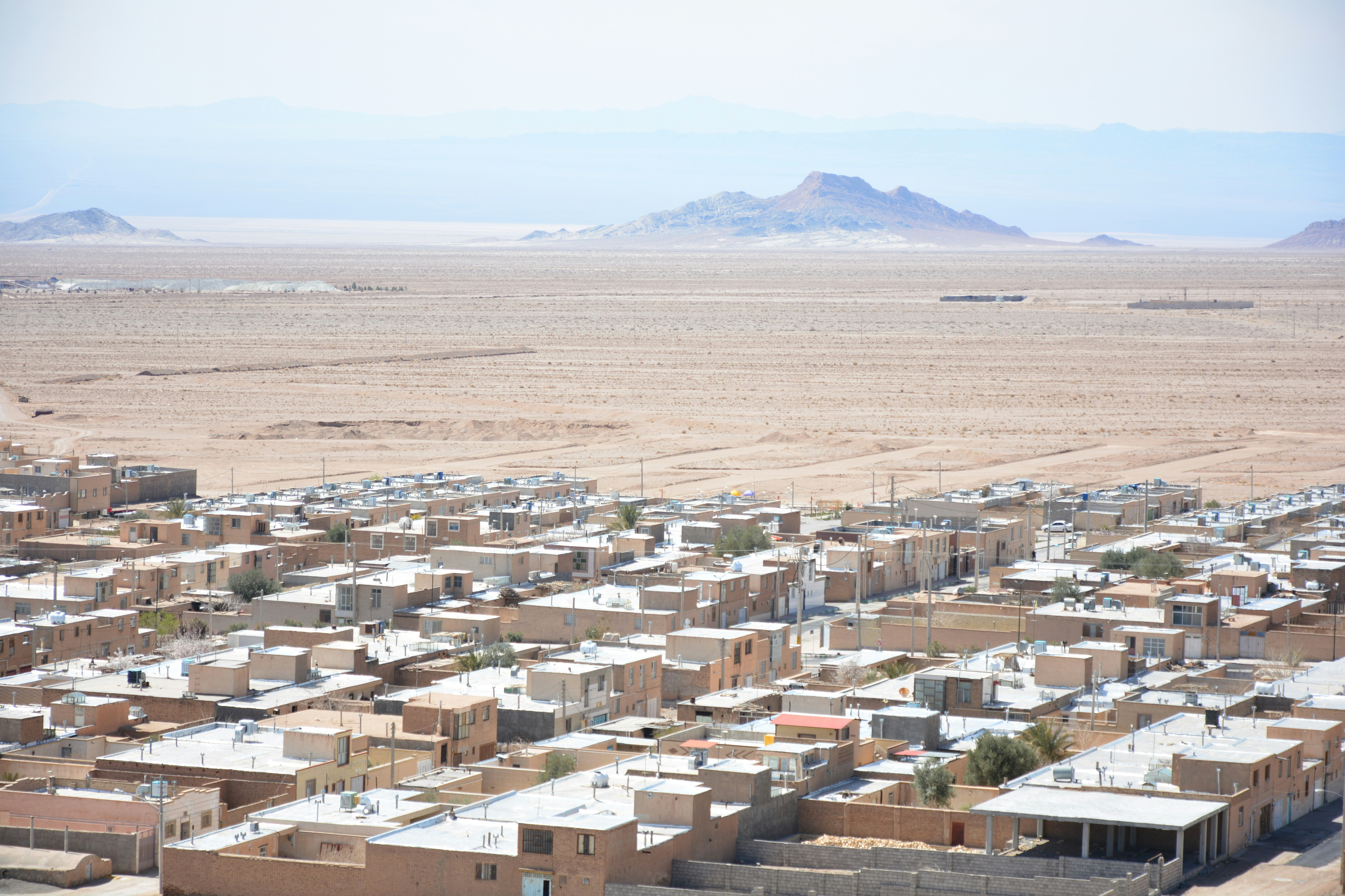Desert town with arid landscape and mountains