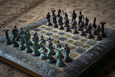 Antique chess set with detailed figures on board.