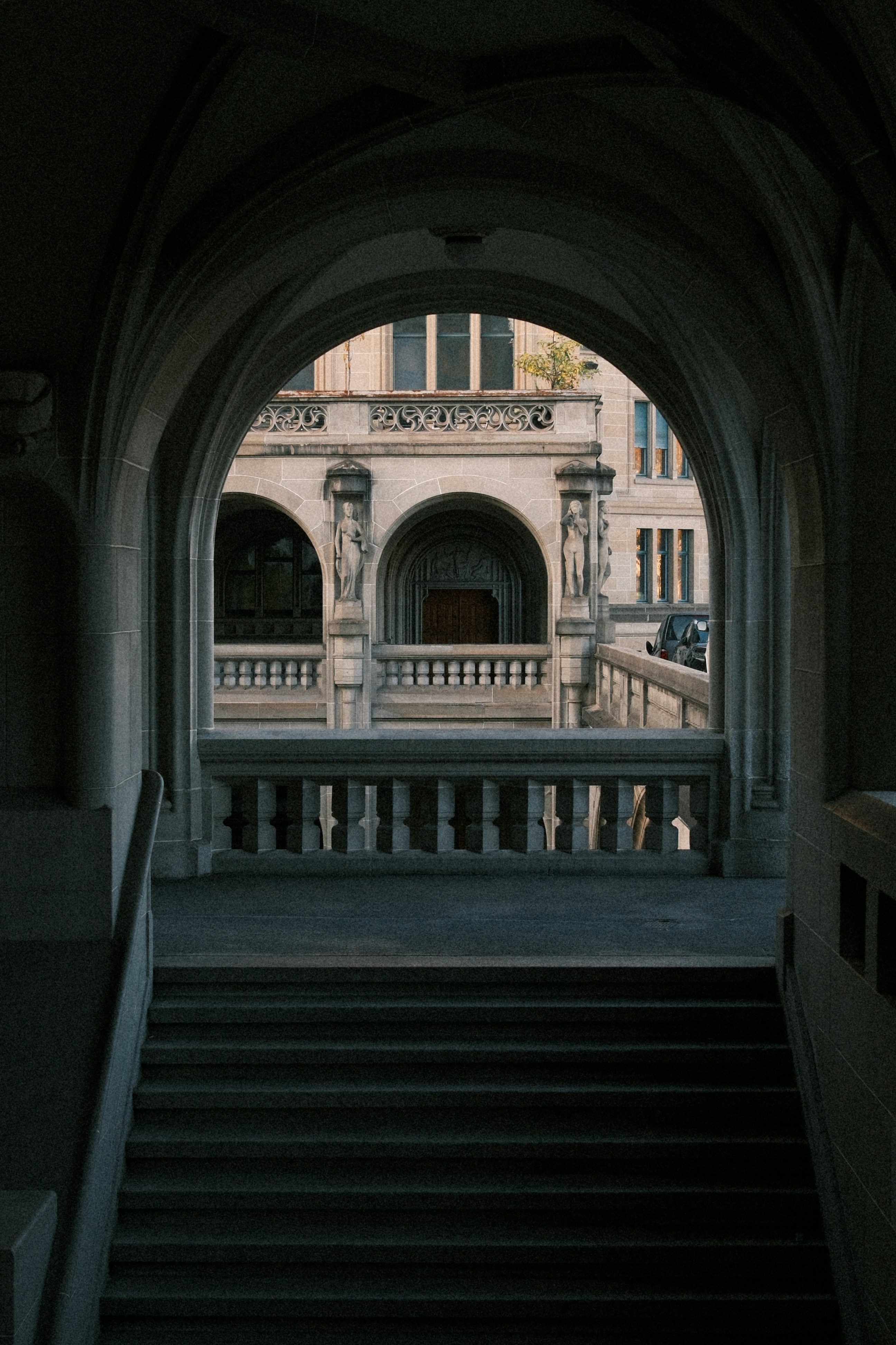 Stone archway leading to a building facade