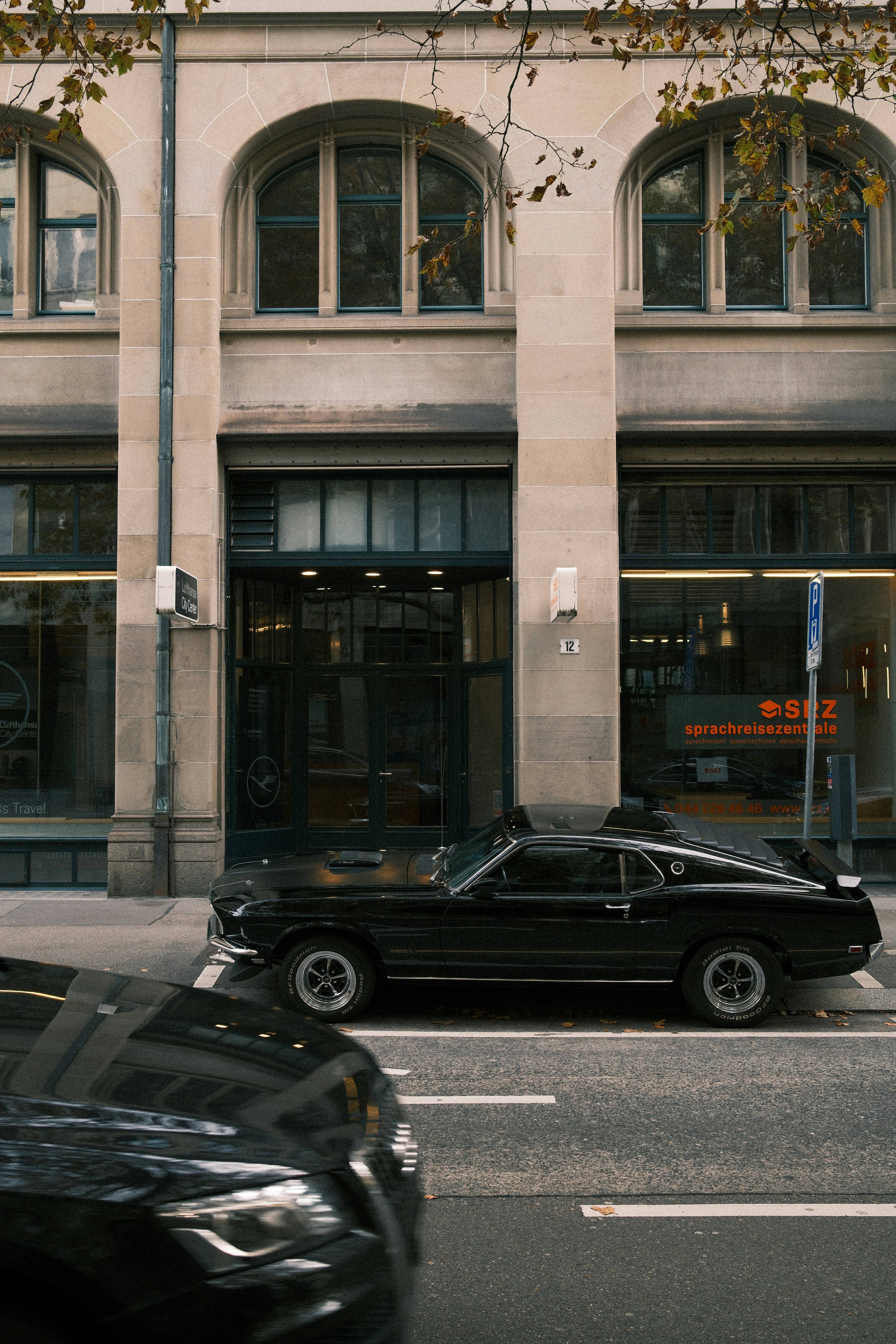 Black vintage car parked on city street