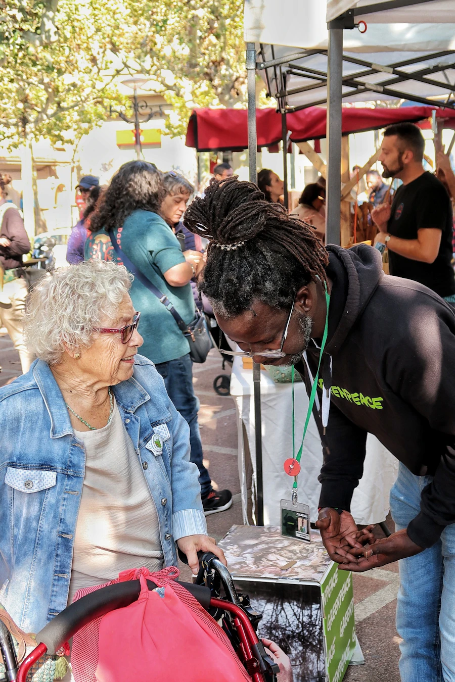 Caregiver supporting a client outdoors