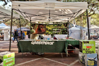 Greenpeace booth with environmental awareness signs