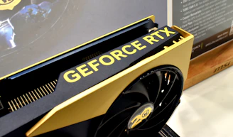 Nvidia geforce rtx graphics card with gold accents.