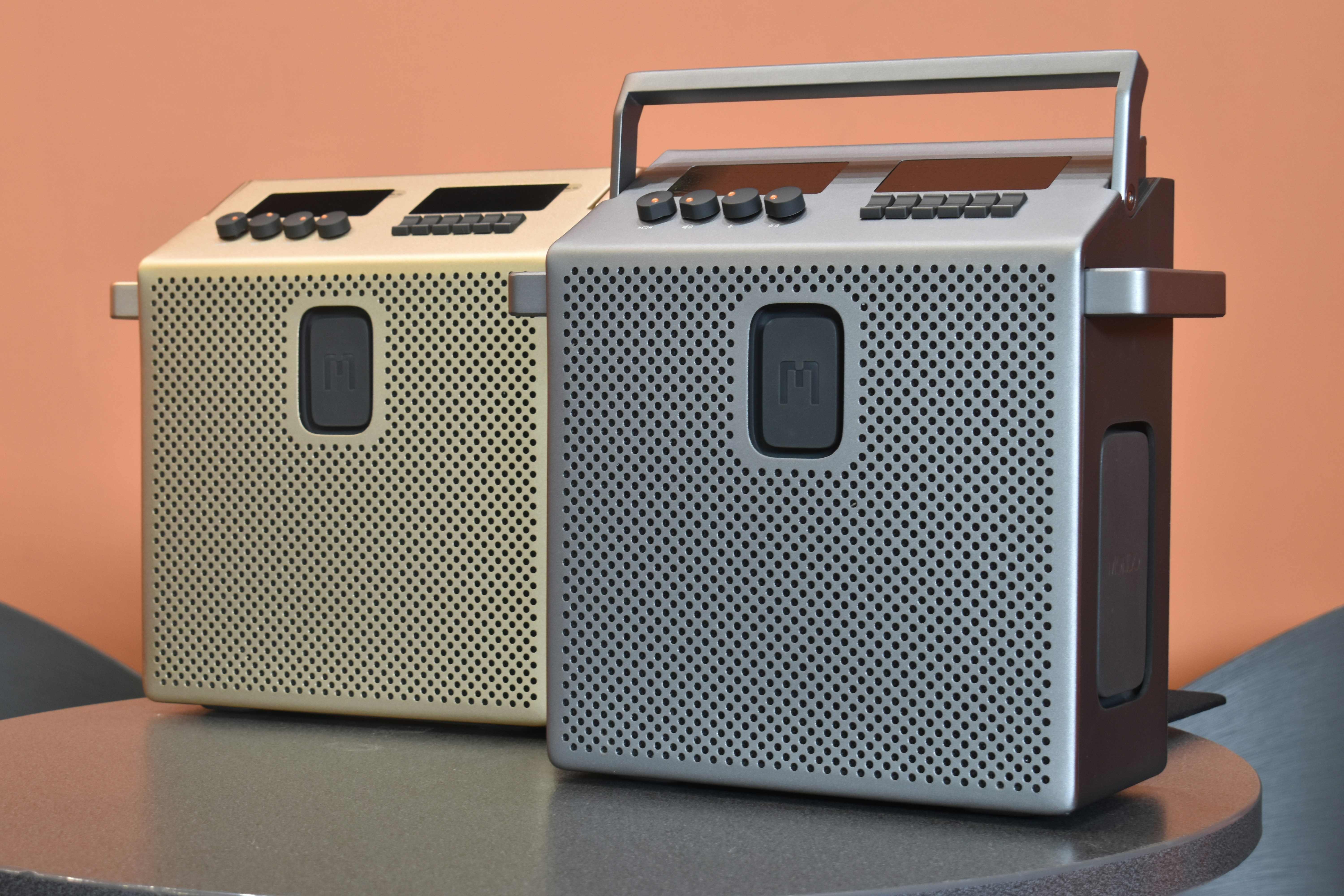 Two modern radios on a table