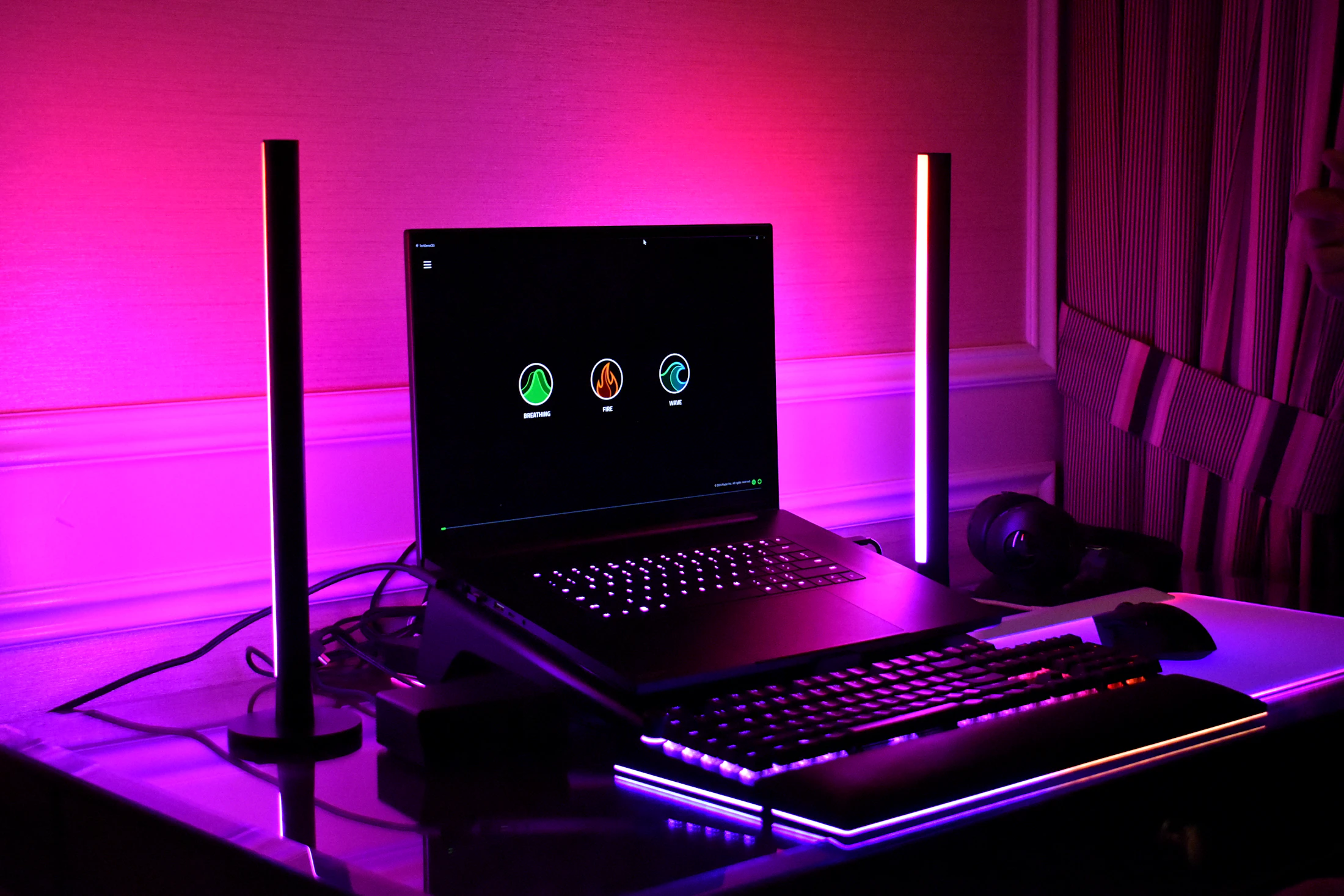 Premium dark gaming desk setup with gaming peripherals and display