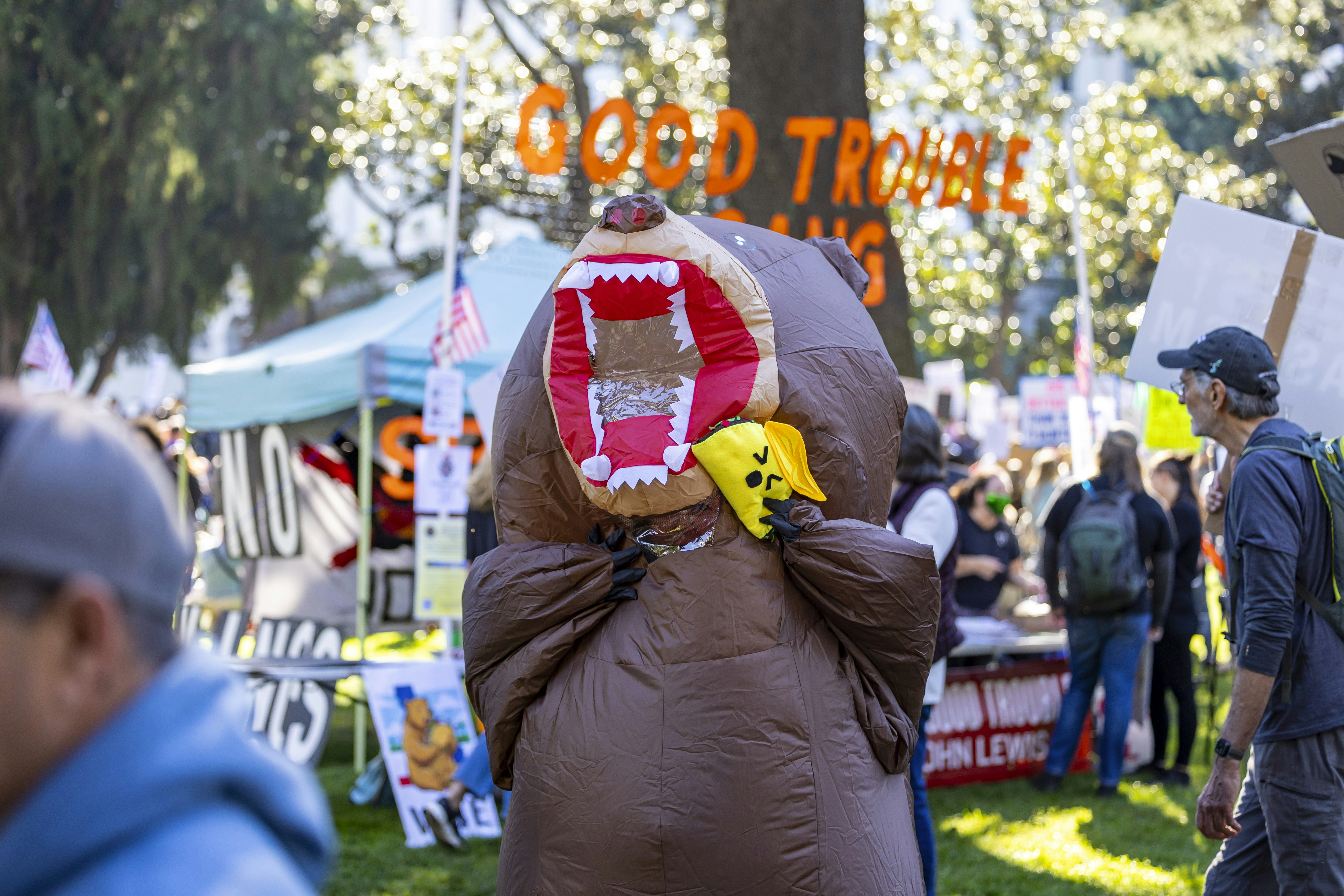 Inflatable bear costume at a protest