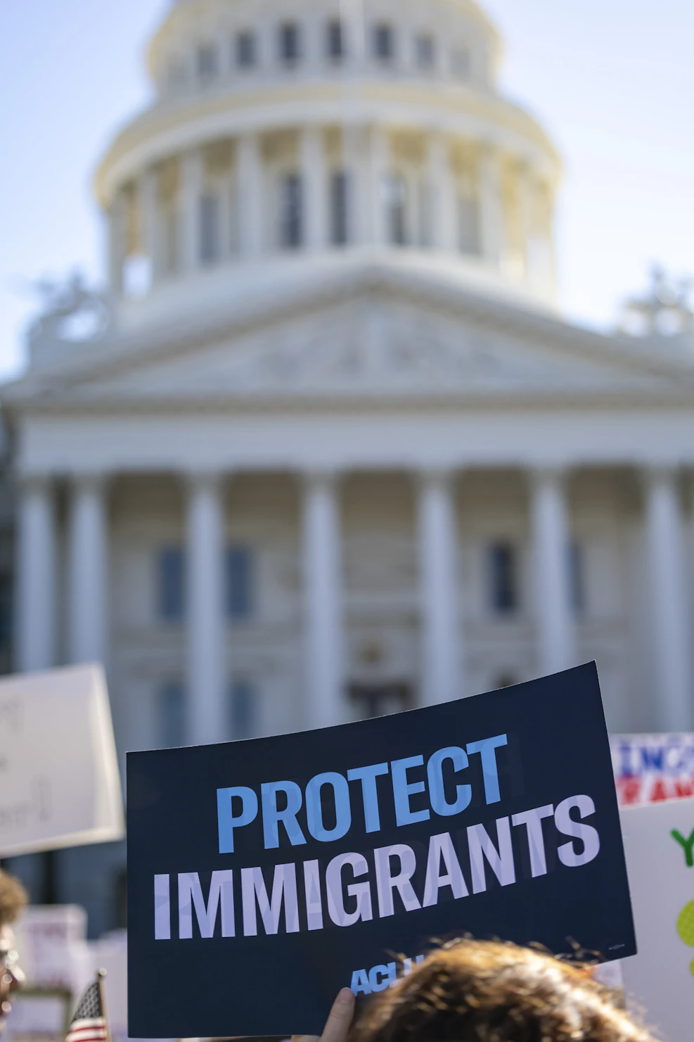 Immigration attorney reviewing case documents with clients.