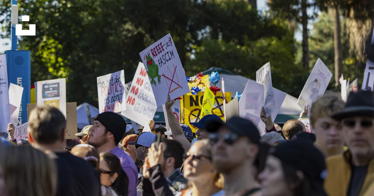 Protest Or Rally Crowd holding signs at a protest or rally. photo – Free Crowd Image on ...