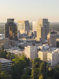 Modern cityscape with tall buildings at sunset