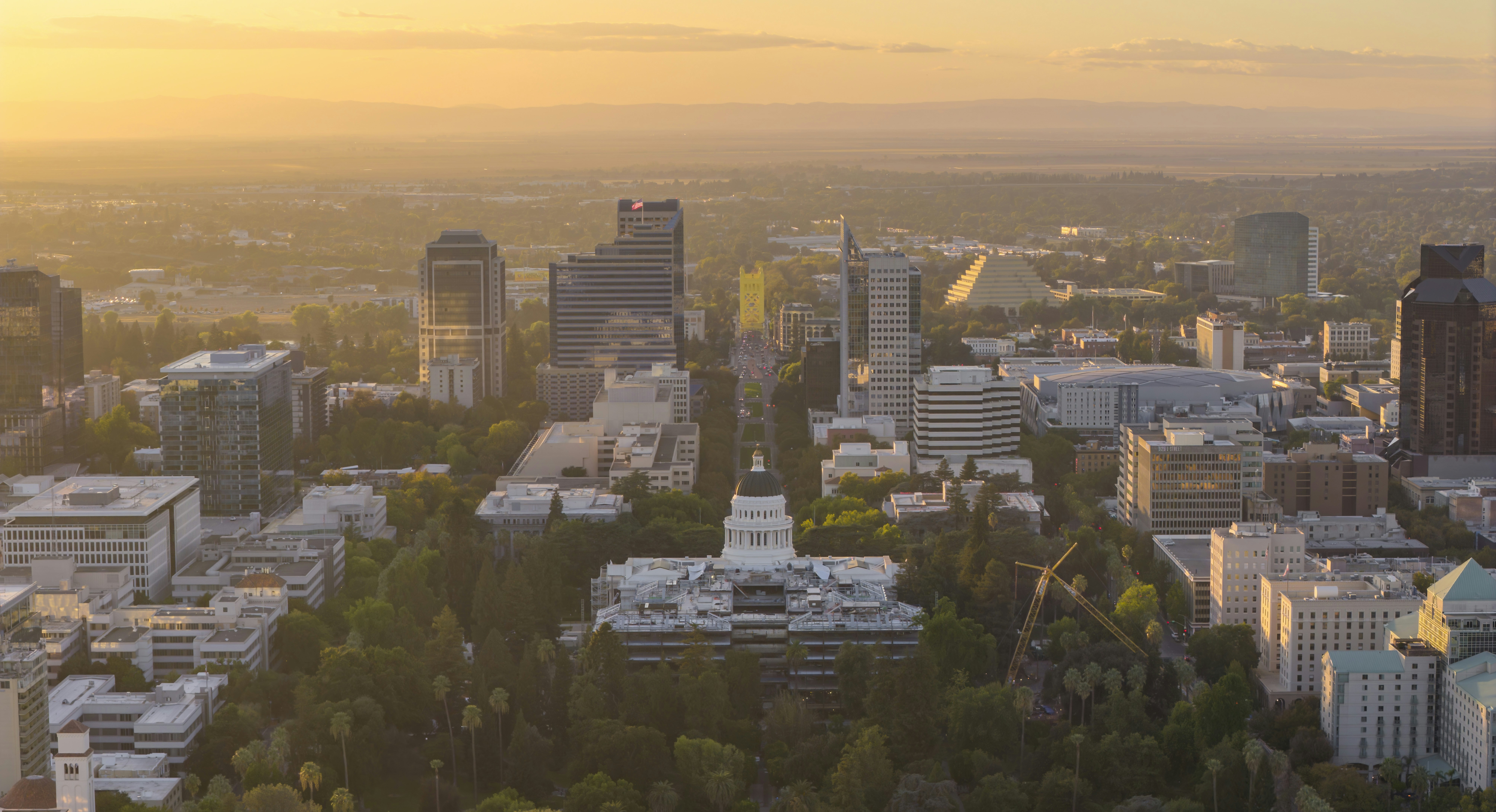 Cityscape with tall buildings at sunrise