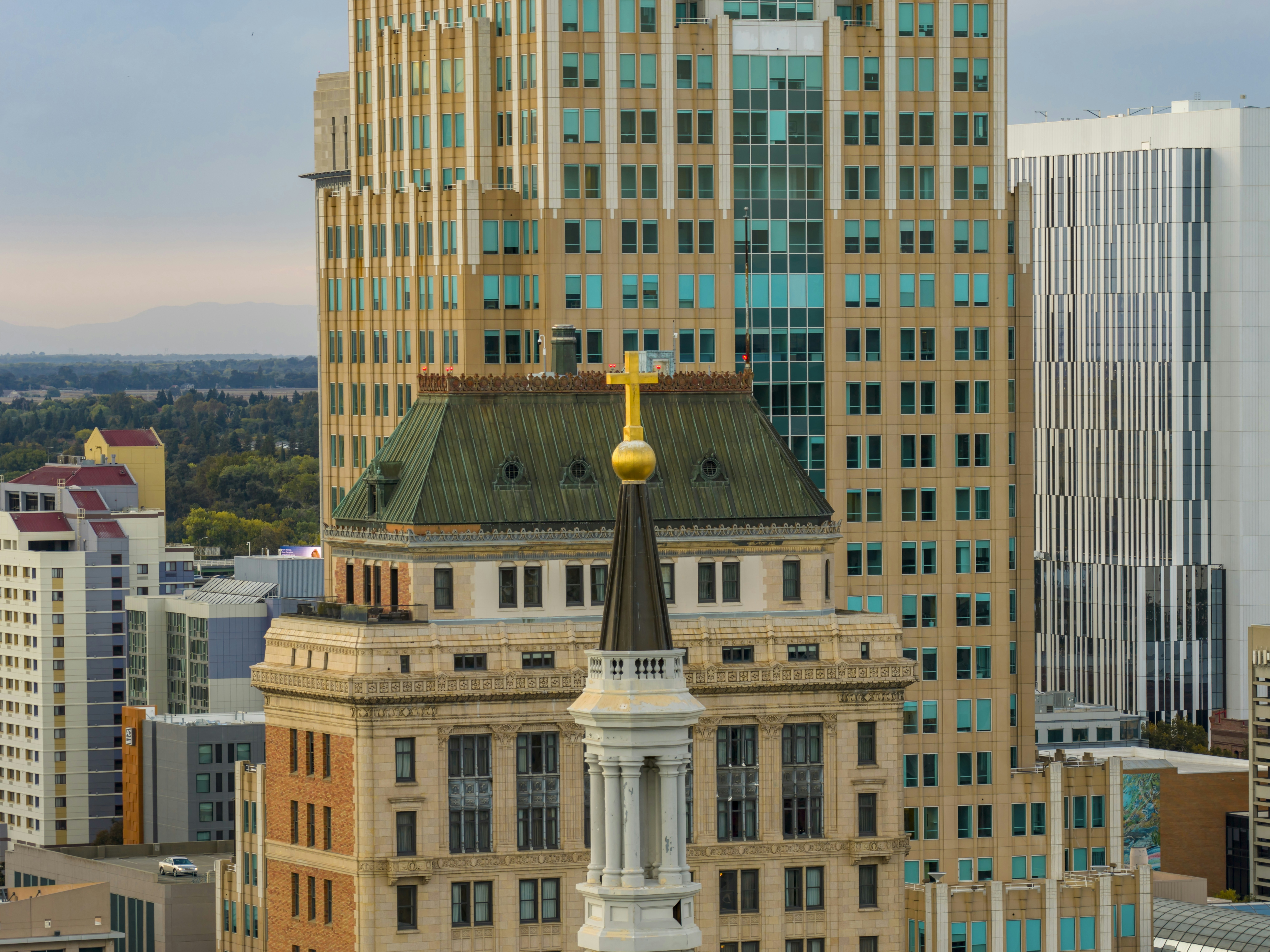 Skyscrapers and church steeple in a city skyline