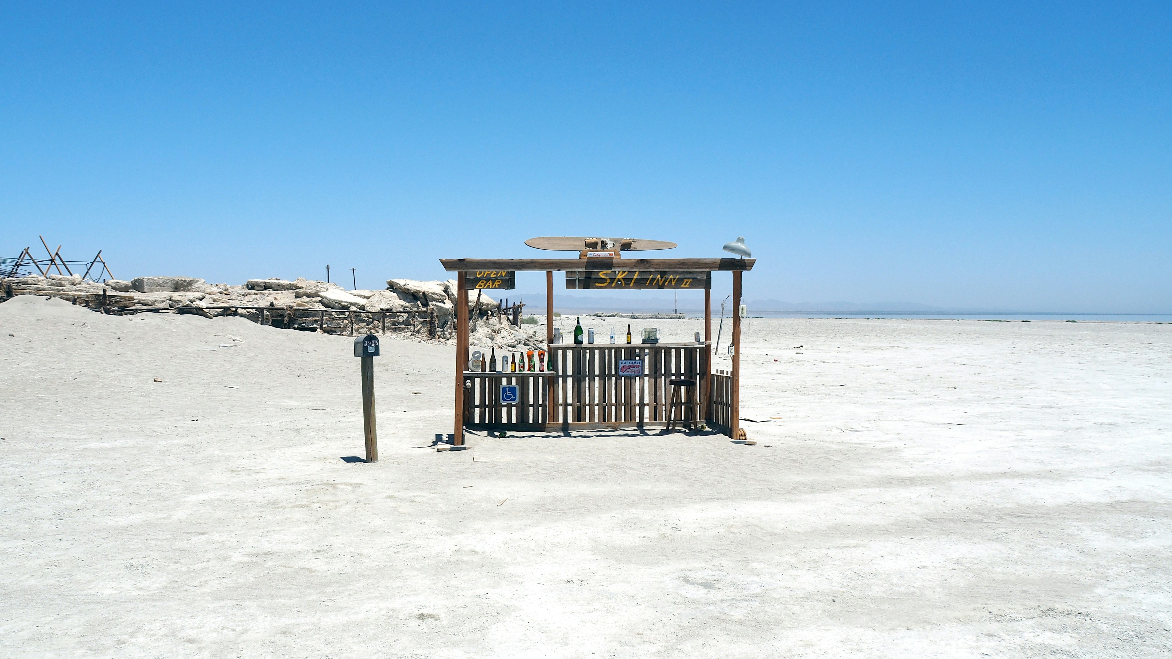 Abandoned shack in a vast, desolate salt flat