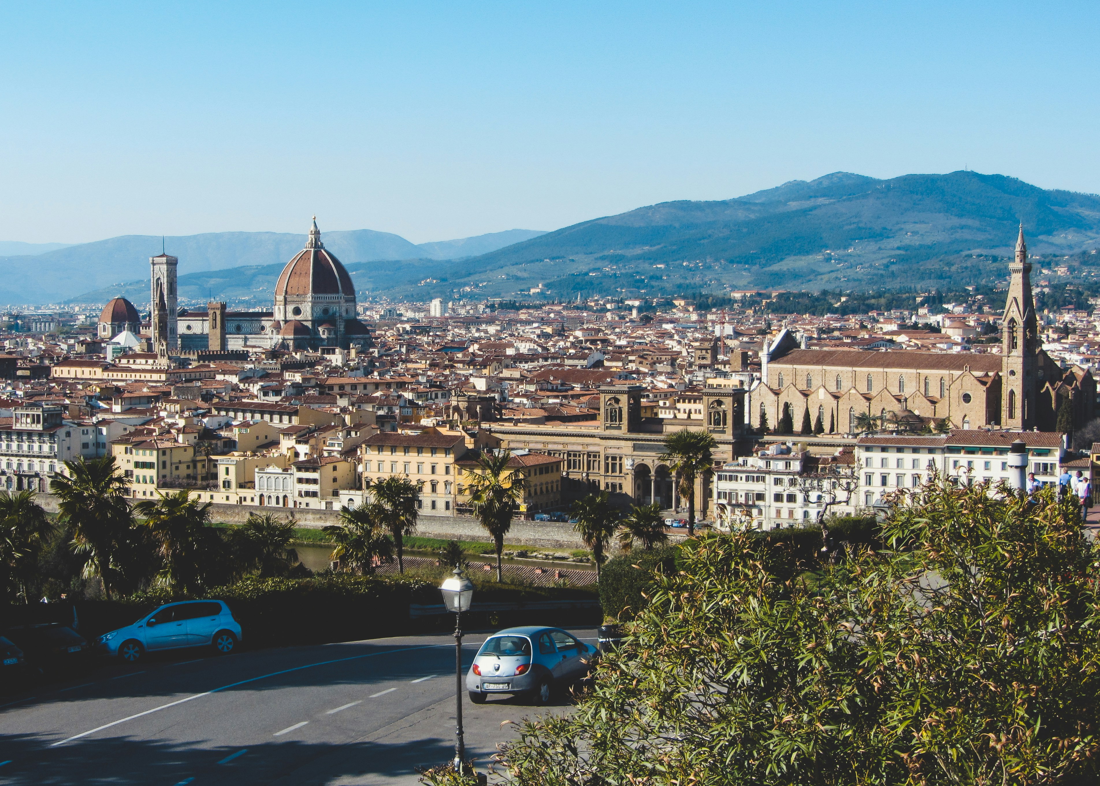 florence cityscape with duomo and mountains in background