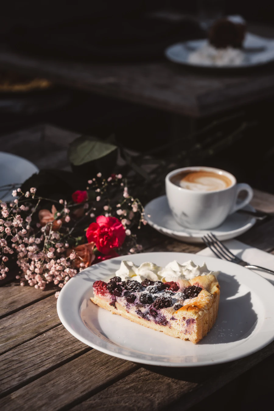 A slice of berry pie with coffee