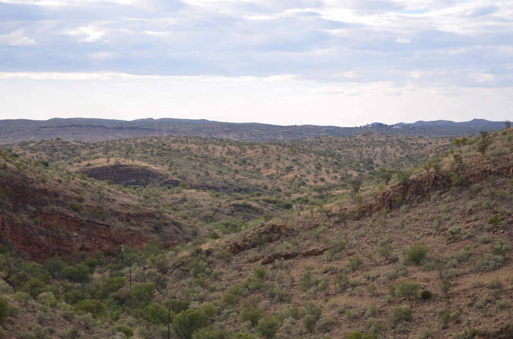 Dry rolling hills and sparse vegetation on the edge of Windhoek