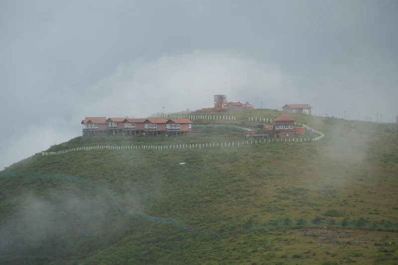 The resort on its hilltop, half-hidden in drifting cloud