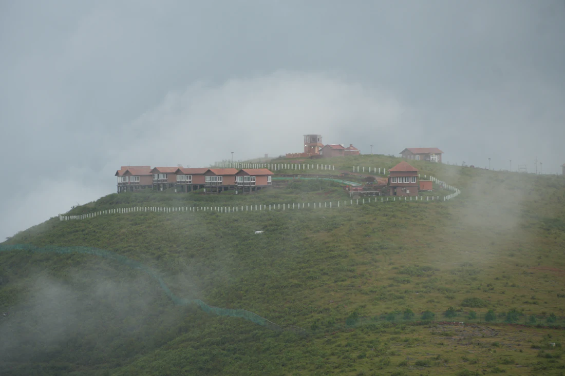 The resort on its hilltop, half-hidden in drifting cloud