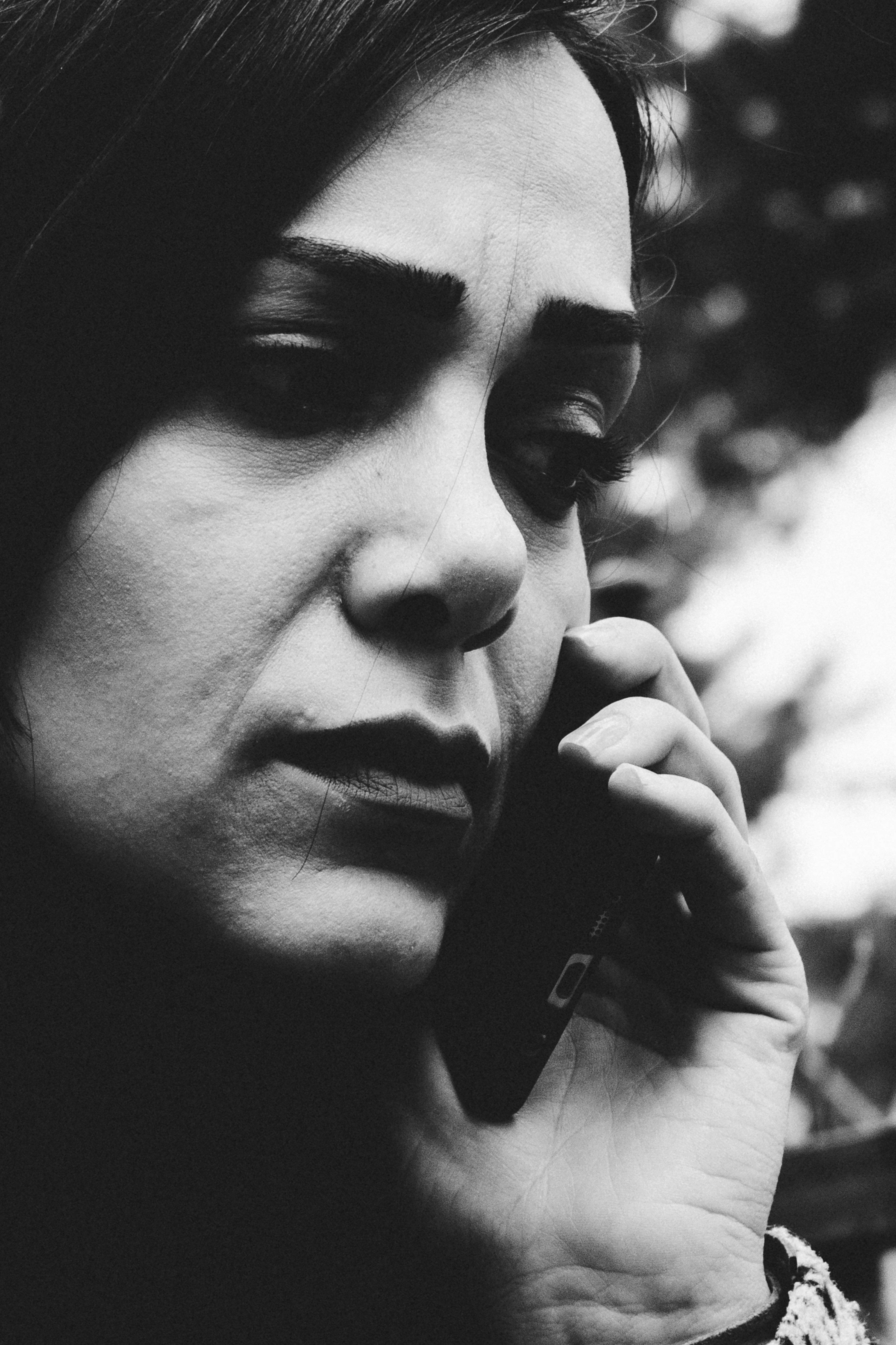 Woman talking on a cell phone with concern