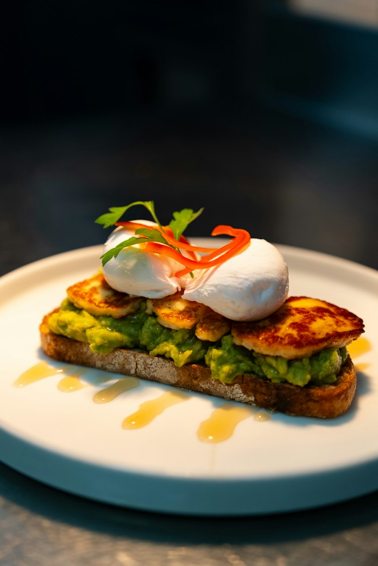 Avocado toast topped with a poached egg