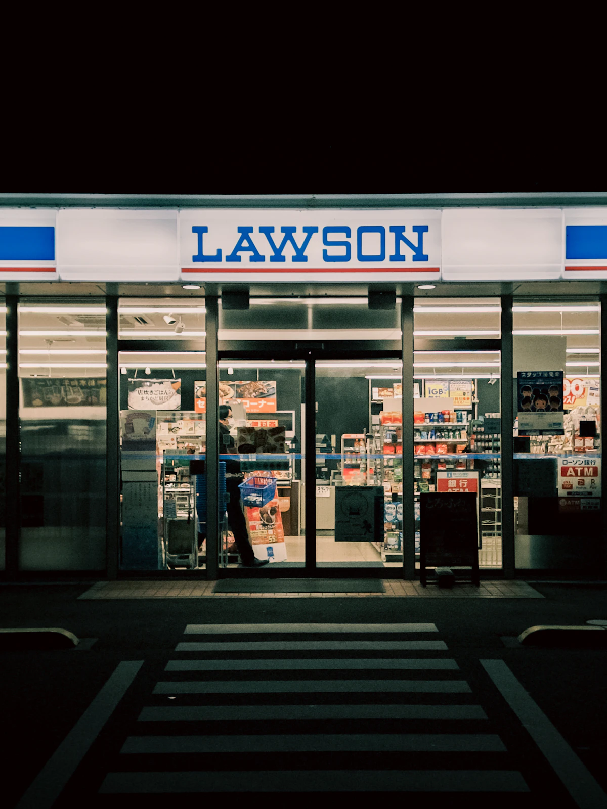 Entrance of a Lawson convenience store at night