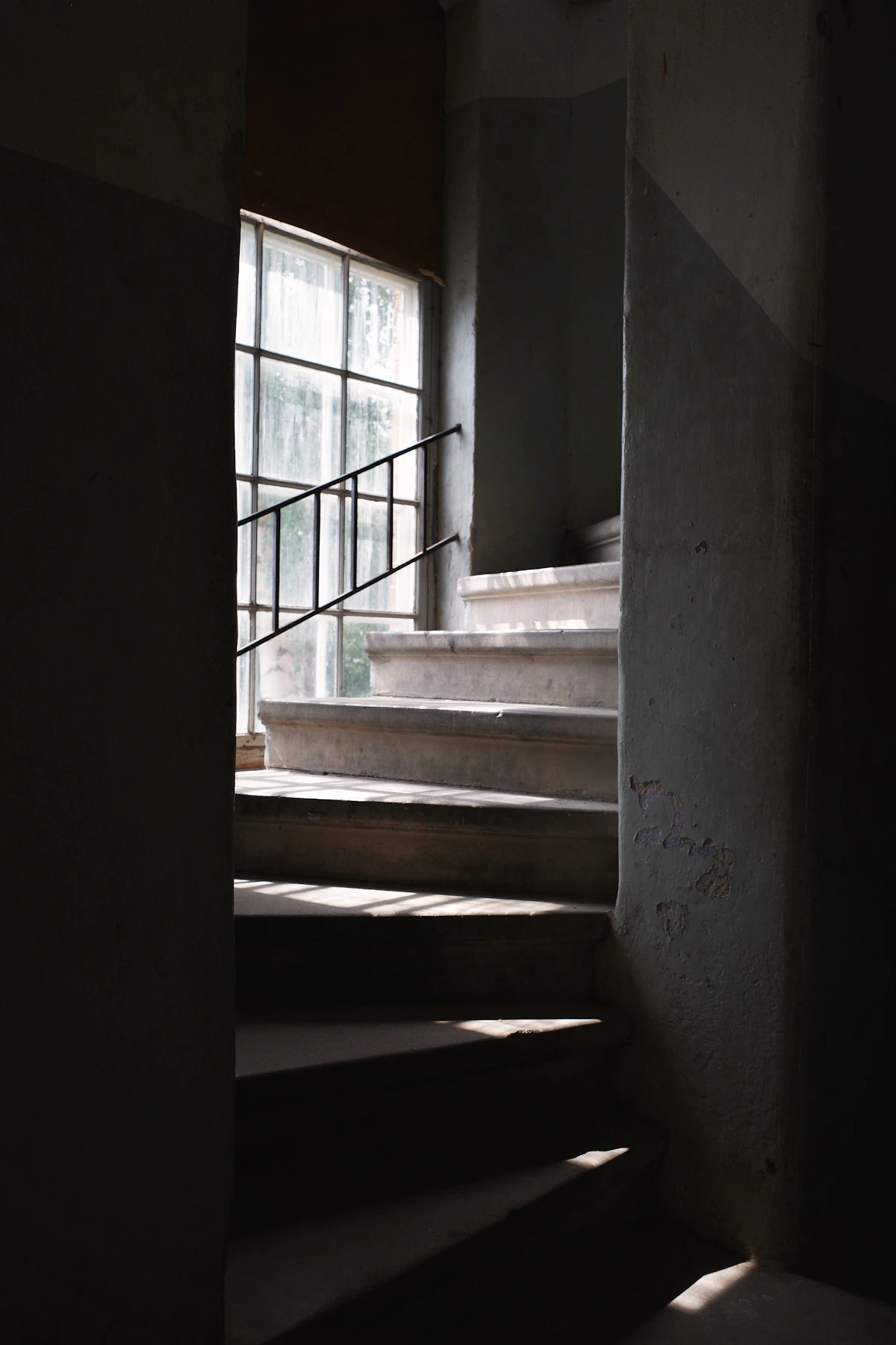 Sunlight falling down a concrete staircase