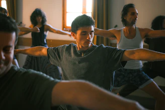 People practicing yoga in a studio