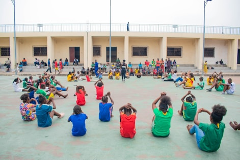Children exercising in a circle outdoors